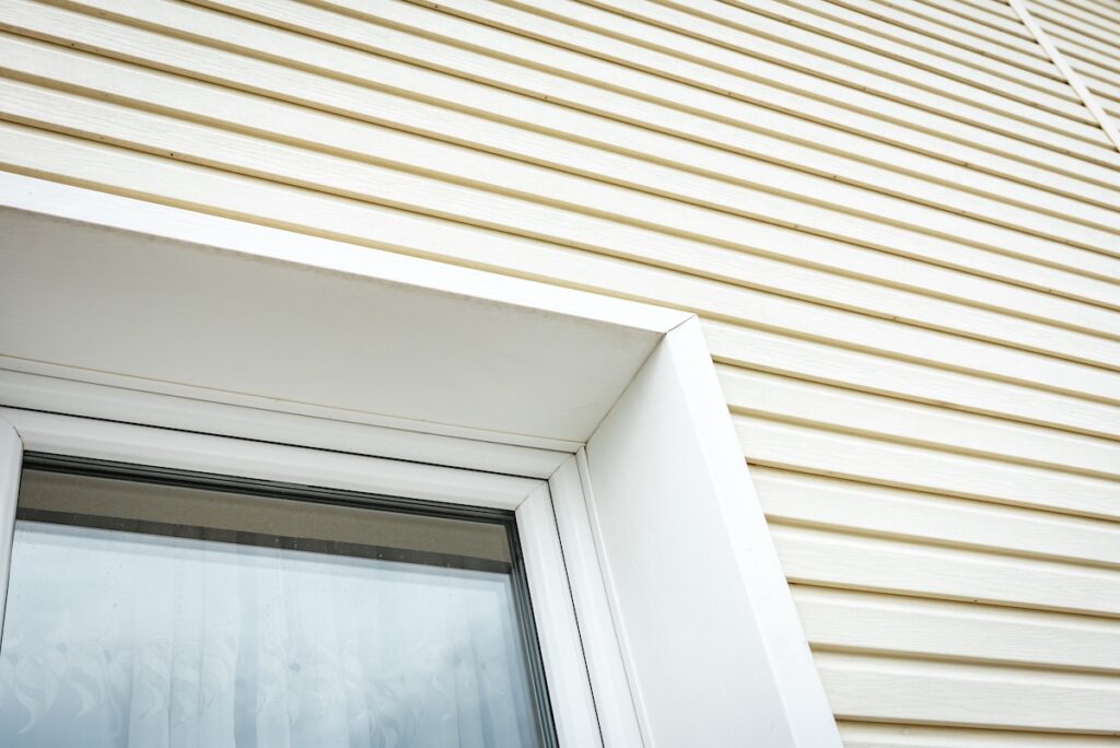 Vinyl siding and windows on new house construction.