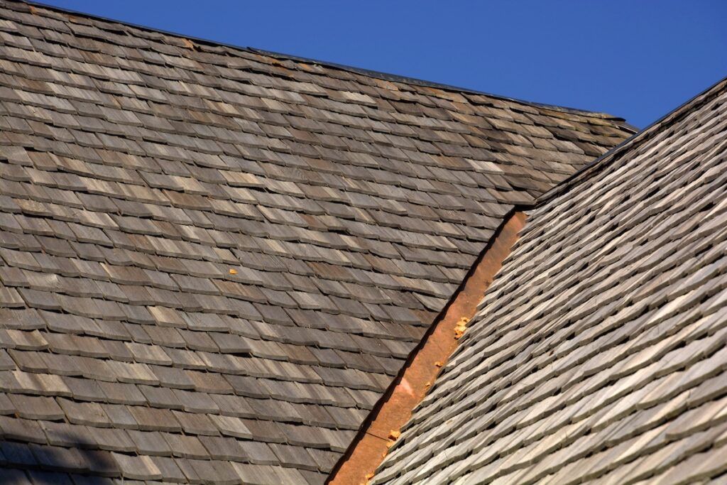 new wood shingle roof with copper gutter, wood shingles on a roof