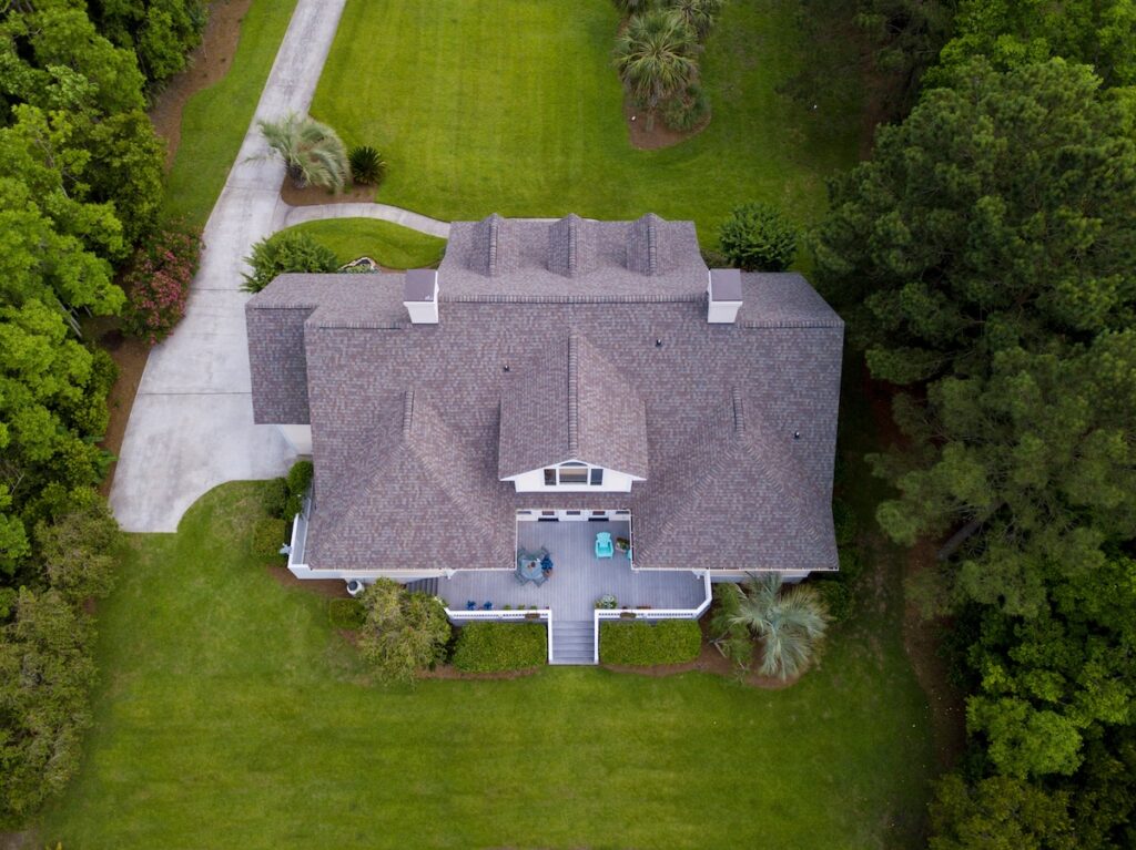 Aerial view of large home with new roof