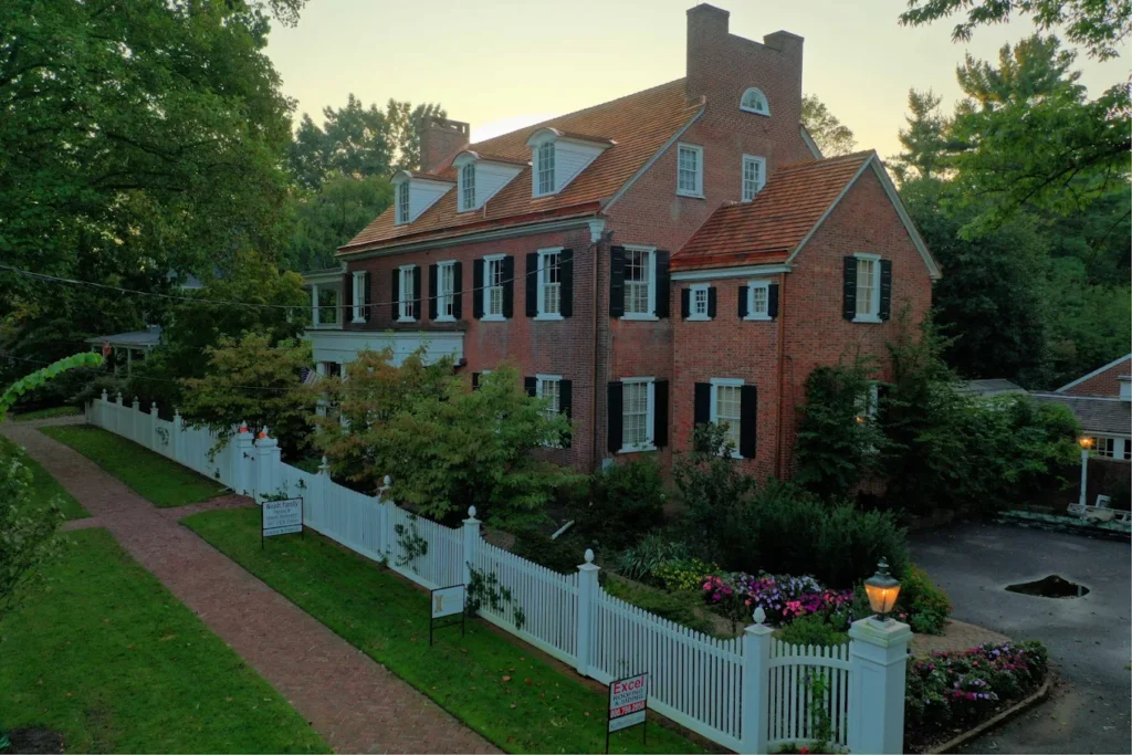 historic roof restoration done by Excel Slate & Copper in Haddonfield, NJ showcasing a cedar roof and pole gutters