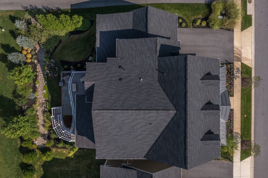 Aerial top down view of a complex hip and valley pitched roof