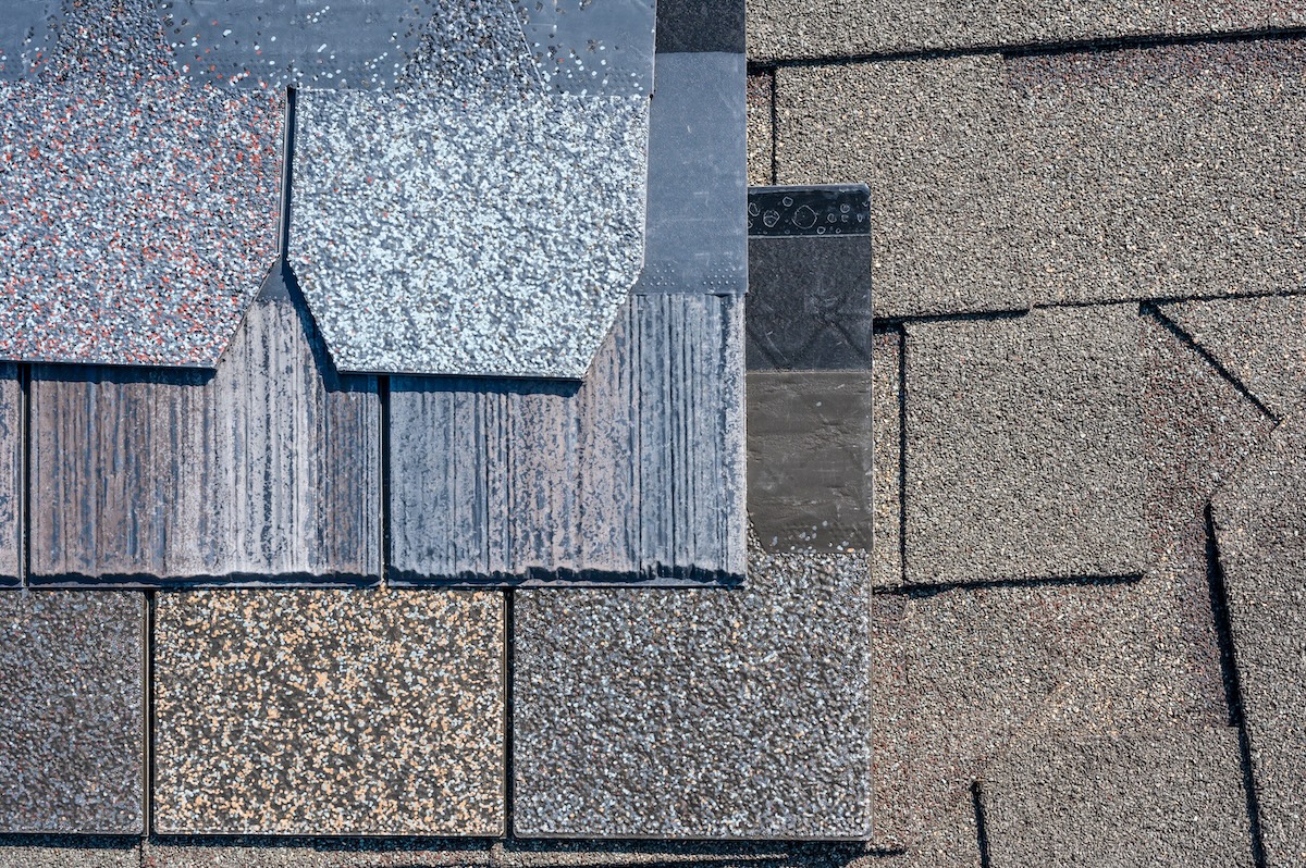 Assorted selection of synthetic roof shingles to pick a new style