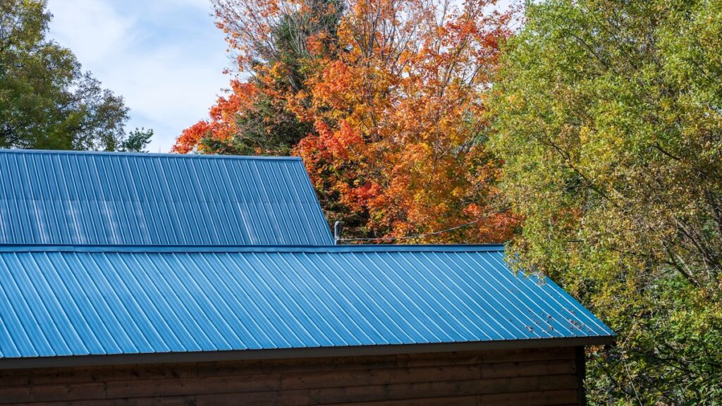 A blue metal roof in the fall colors