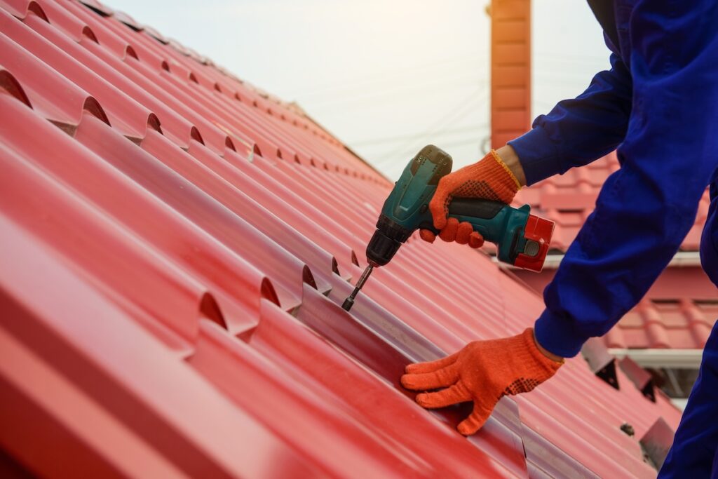 roofer fixing metal roof