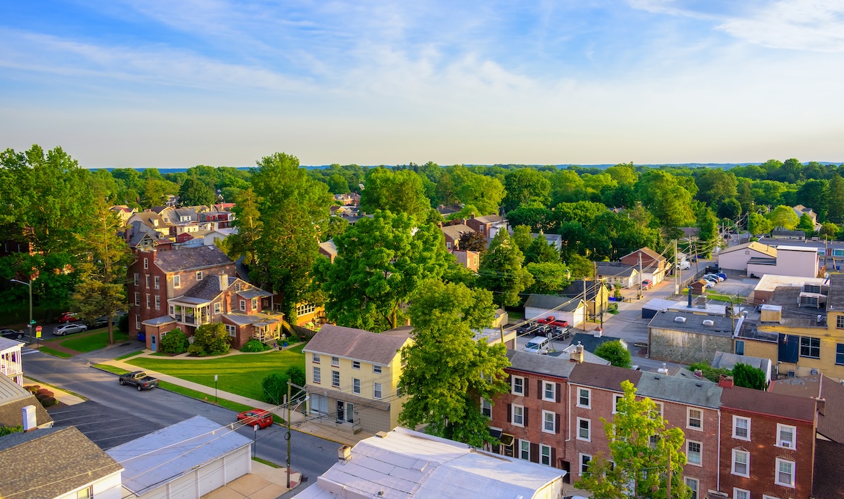 Aerial view of suburban houses and sunset sky - New Jersey, USA