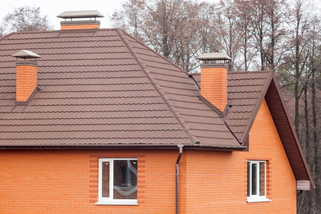 rick house with modular chimney, Stone Coated Metal Roof Tile, plastic windows and rain gutter