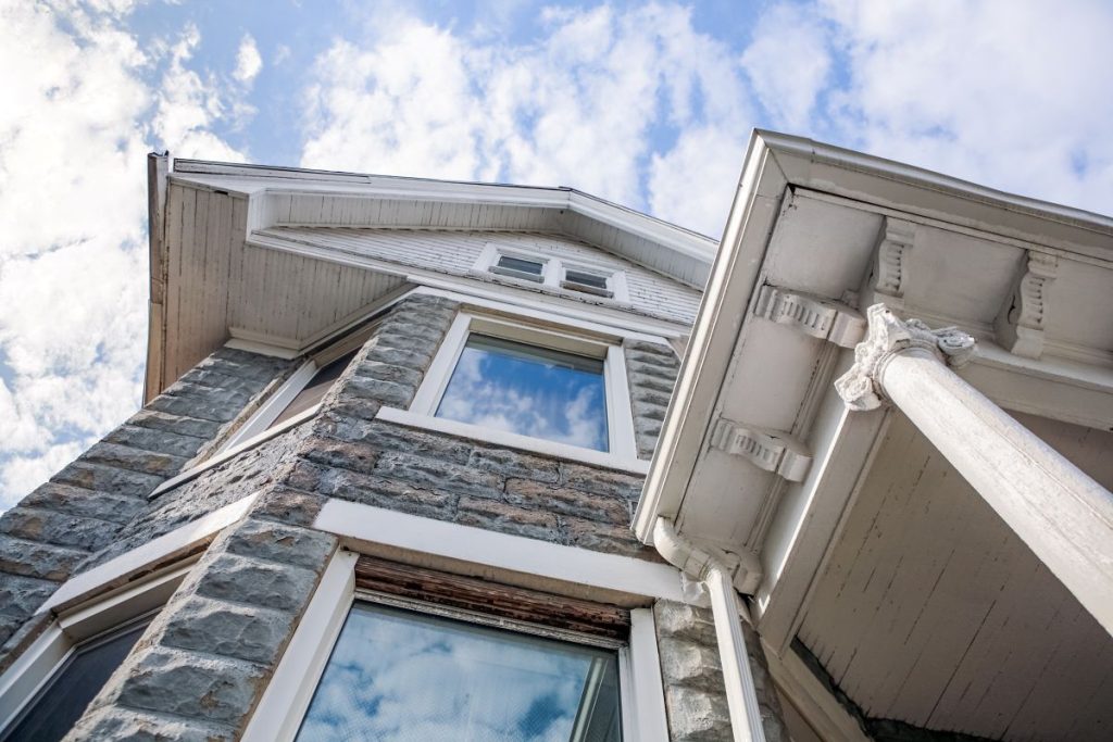 Vintage rock faced block or rusticated concrete block architecture style home